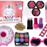 Make-upset voor kinderen met nagellakken, oogschaduw en accessoires in donutbox