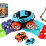 Racing track for kids with changeable pieces and a luminous car
