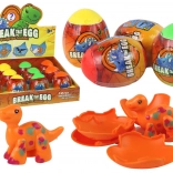 Oeuf de dinosaure magique craquant dans sa coquille 4 couleurs 6 cm