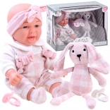 Adorable baby doll with plush bunny and pacifiers