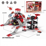 Parkeerterrein met 6 metalen auto’s en helikopter